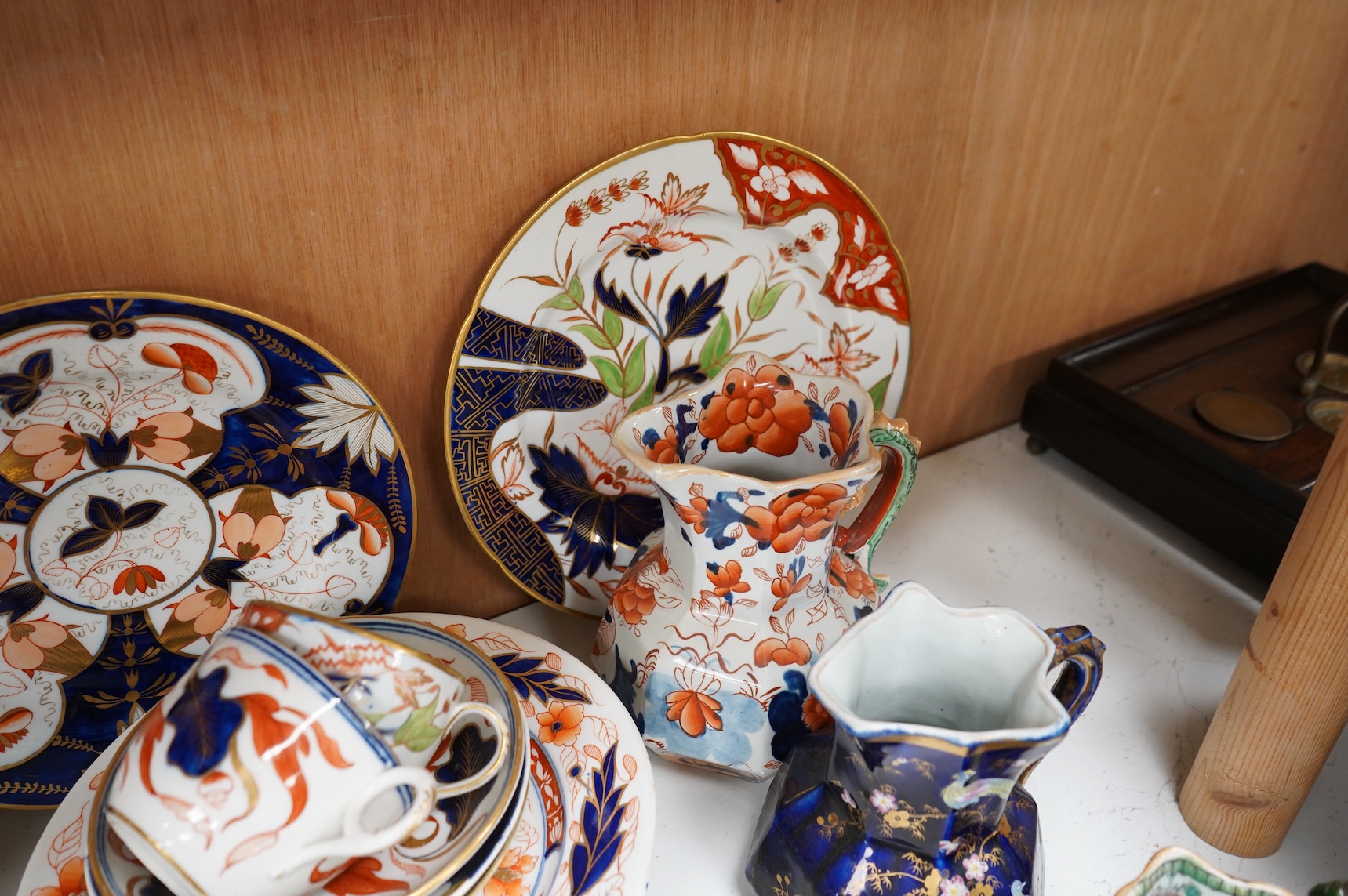 A collection of 19th century English ironstone china to include two pairs of sauce tureens, covers and stands, one marked Masons, various side plates and teacups